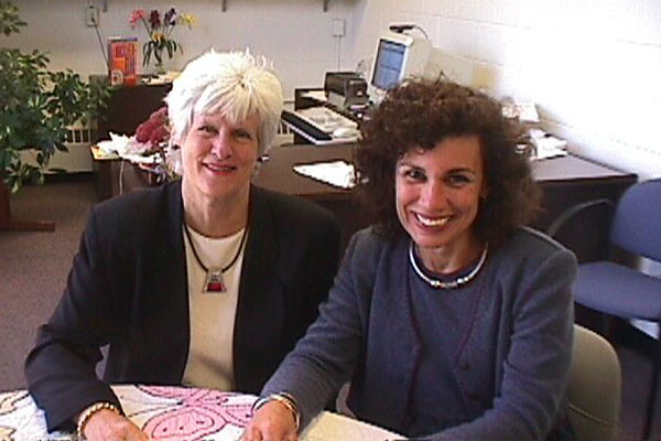 Two women sitting at an office table