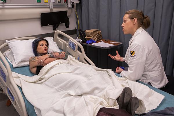 Vanderbilt SANE student Eden Vinyarszky (right) talks to a "patient" 