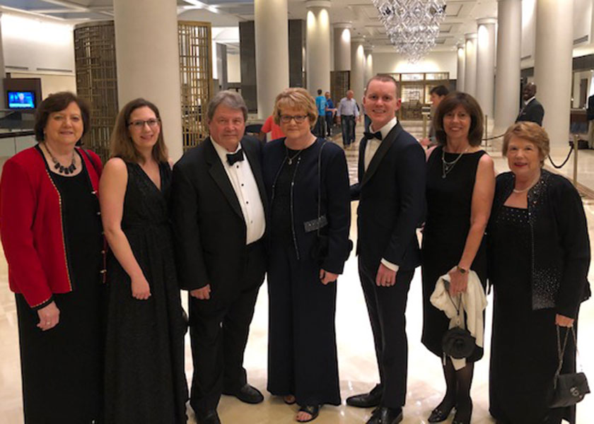 Group of seven people in formal dress looking at the camera. There are two men and five women. In the center of the photo is Vanderbilt's Betsy Weiner, who is receiving an award at the gala event.