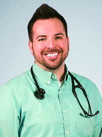 Joshua Thornberry in mint button down shirt with stethoscope around his nec;