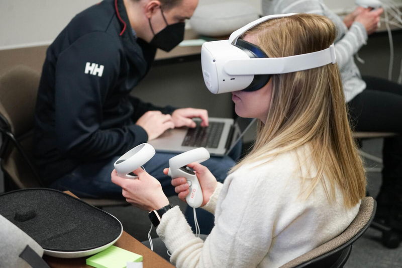 a student wears a virtual reality headset