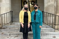 two people in masks on stairs