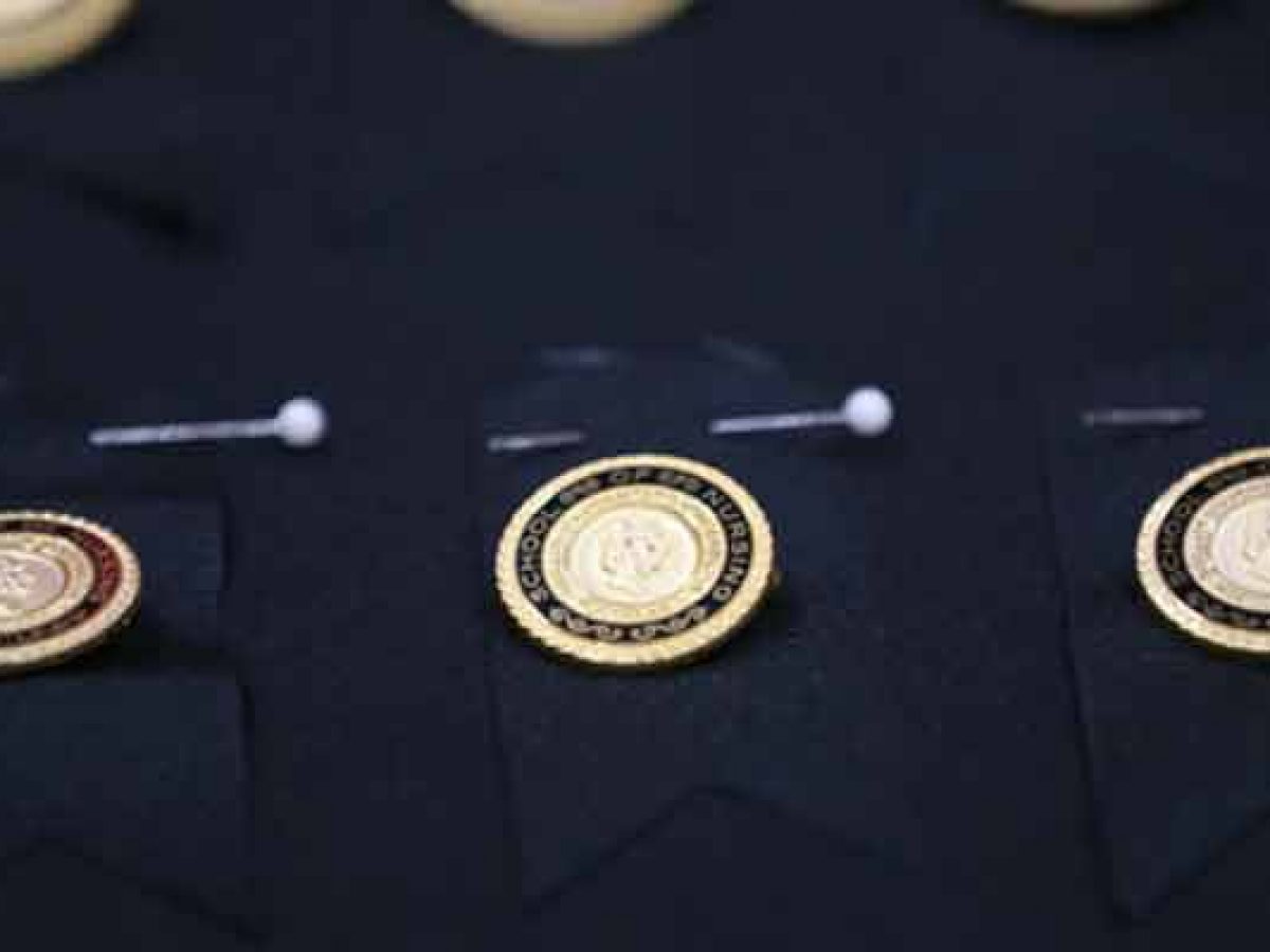 nursing pins on a black background