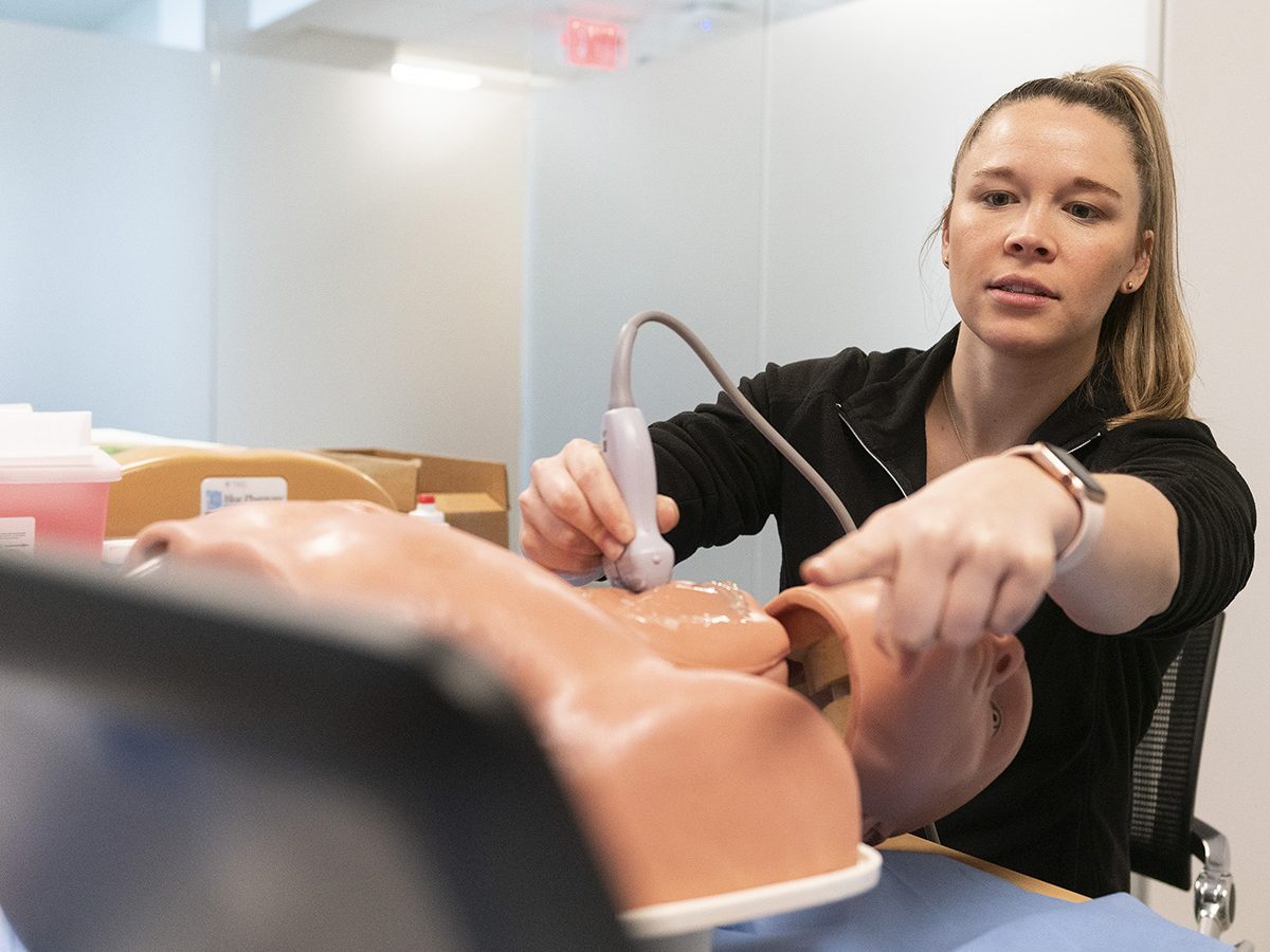 Student in an Ultrasound Course practicing on mannequin